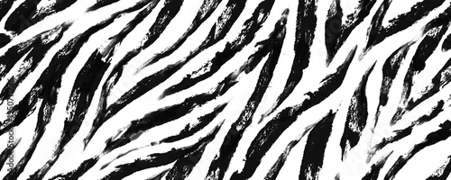 Fototapeta na wymiar Seamless pattern with black and white zebra stripes painted with a dry brush. Horizontal background with hand drawn animal skin texture