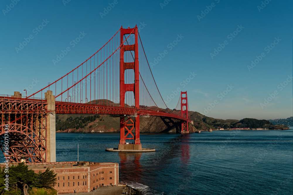 Fototapeta premium Colorful Structures Over Calm Waters. Vividly Painted Bridge Connecting Busy Harbor To Cityscape