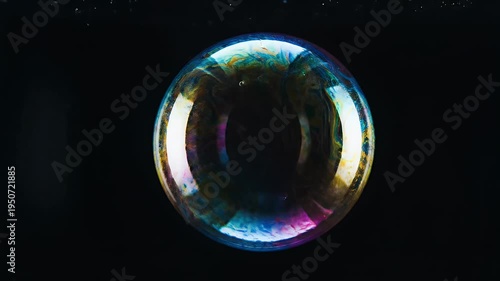Mesmerizing Iridescent Soap Bubble Floating Against a Dark Background.