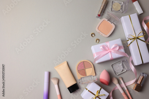 Makeup Display With Festive Gifts, Elegant Makeup Setup Alongside Wrapped Presents And Accessories