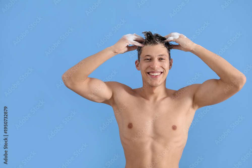 Obraz premium Man washing his hair with shampoo on light blue background, space for text