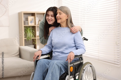 Φωτογραφία Senior woman in wheelchair with her caretaker at home