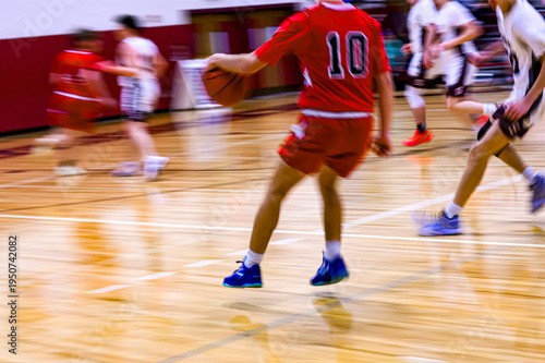 High School Basketball with motion blur showing the speed and movement of the young boys playing the game at Oxford HS in Upstate NY