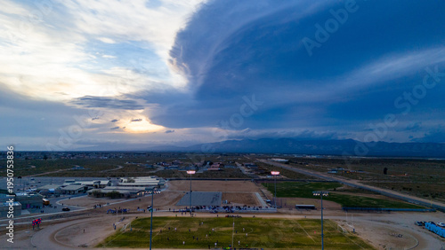 Stormy Dusk: Moody Sunset Over the High School Soccer Field