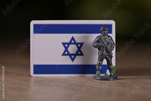 A tin soldier on the background of the Israel flag.