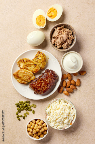 High protein foods with chicken, beef, eggs, tuna, cottage cheese and nuts, top view