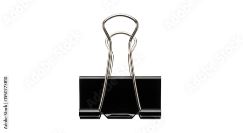 A metal binder clip on a black background on transparent background
