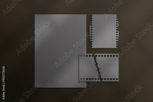 Abstract geometric shapes with perforated edges against a dark background