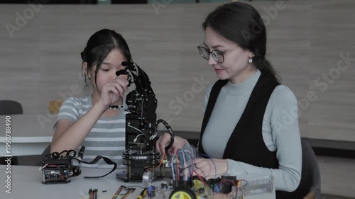 student learning about controlling robot with hands in robotics engineering class