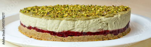 Delicious cheesecake with raspberries and pistachios
