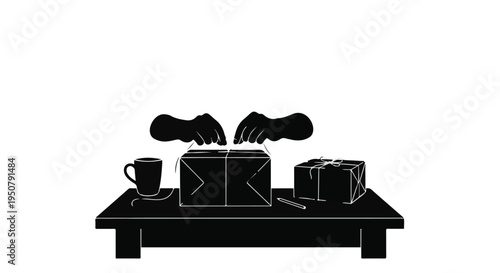 Black silhouette of hands packing gifts on table