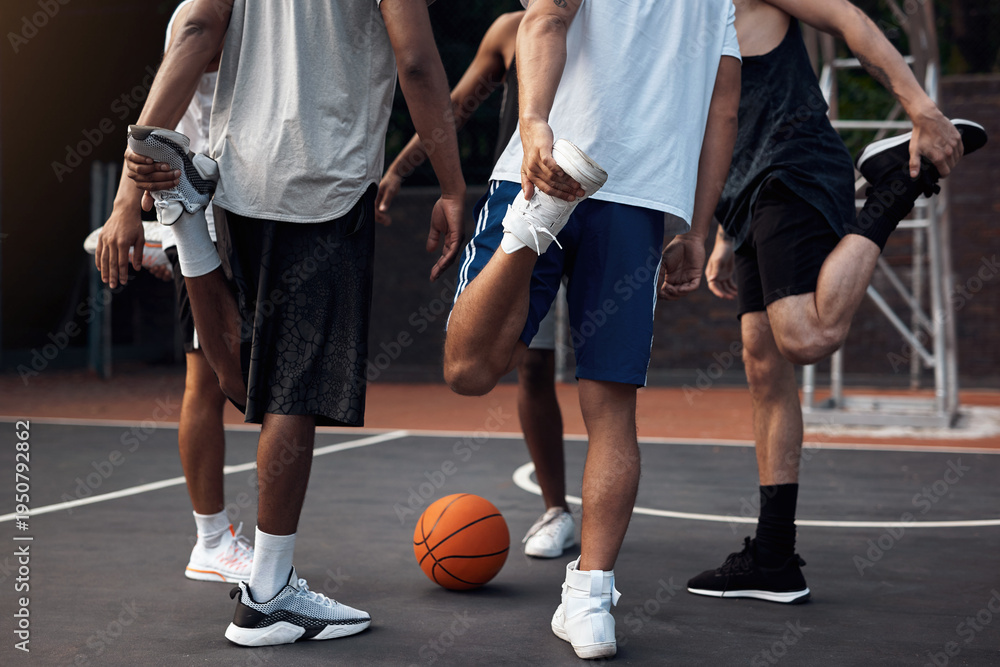 Fototapeta premium Basketball, legs and stretching with friends outdoor together for start of competition or game. Getting ready, preparation and warm up with group of people on court for exercise, fitness or sports