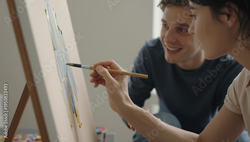 Young Couple Painting Together on Canvas at Home