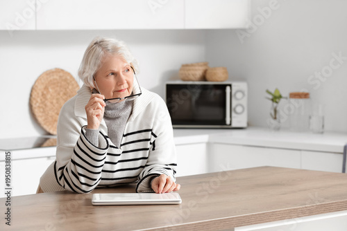 Thoughtful senior woman wit...