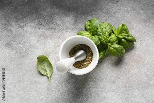 Mortar with pestle, herbs a...