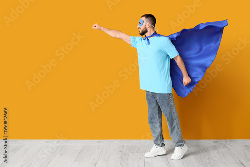 Young man dressed as superh...