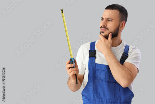 Thoughtful young male const...