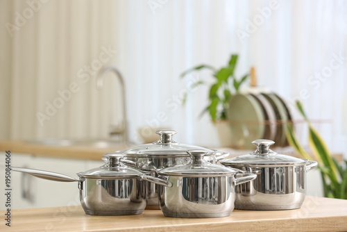 Stainless cooking pots on w...