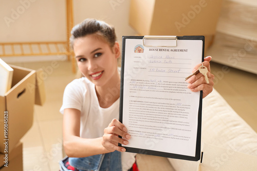 Young woman with house rent...