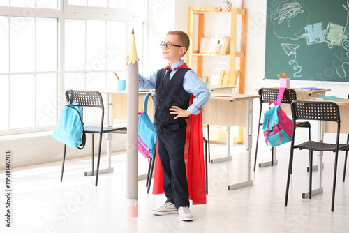 Cute little schoolboy with ...