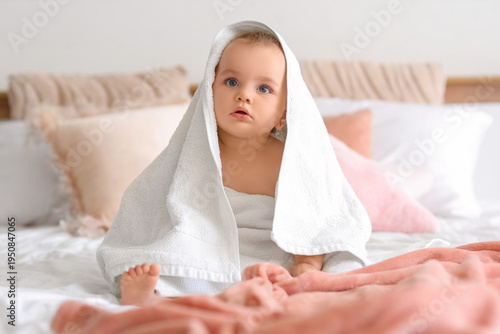 Cute little baby with towel...