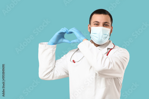 Young happy male doctor in ...