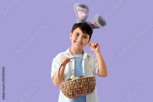 Cute boy in bunny ears hold...