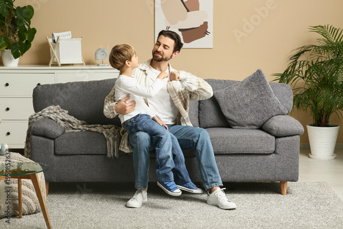 Dad and little son making f...