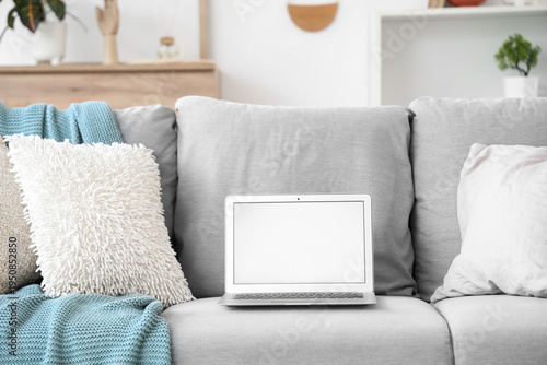 Blank laptop with cushions ...