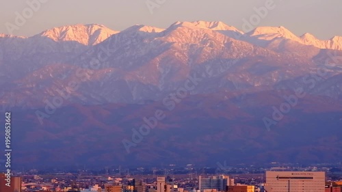 Wallpaper Mural 夕景呉羽山からの眺望　茜色に染まる都市市街地ビル群と北アルプス立山連峰と市街地 Torontodigital.ca