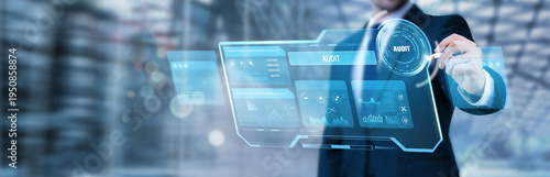 Фотография Businessman pointing at a digital screen and analyzing financial audit process,