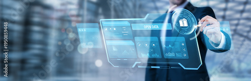 Fotografi Businessman pointing at a digital screen and analyzing open data platforms, publ