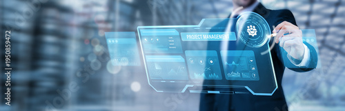 Foto Businessman pointing at a digital screen and analyzing project management strate