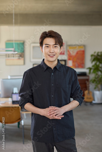 Confident businessman standing poised in the office