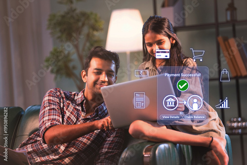 Indian young father and daughter doing online digital payment successful on laptop for household bills and savings to promote financial literacy and inclusion in digital india