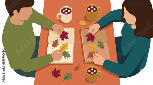 Two people making autumn leaf art with hot chocolate, top view