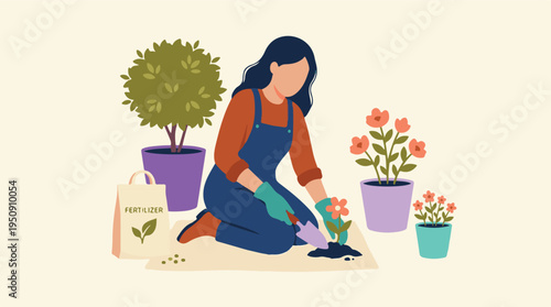 Woman gardening, planting flowers with a trowel in a home garden setting