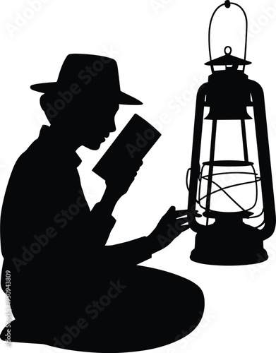 Silhouette of a person wearing a fedora hat sitting and reading a book next to a large vintage oil lantern