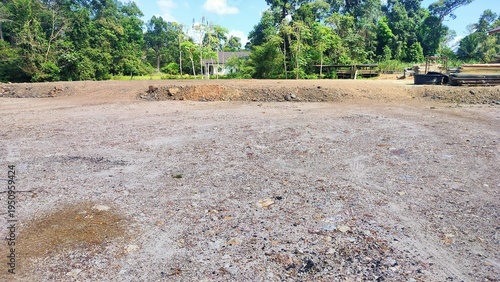A leveled mound of land that was leveled to create a house construction site. The Construction clay for road construction in working area