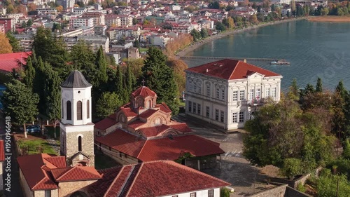 Drone footage of the Archbishopric of Ohrid revealing the Lake Ohrid waterfront and the old town, highlighting historic Orthodox architecture and the scenic Balkan cityscape.