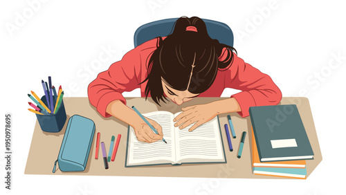High angle view of a young girl focused on writing in her notebook at a desk filled with pens and school supplies.