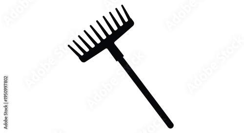 Black garden rake shown in a striking minimalist silhouette