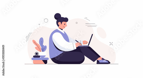 Young person sits cross-legged using a laptop computer with plants nearby