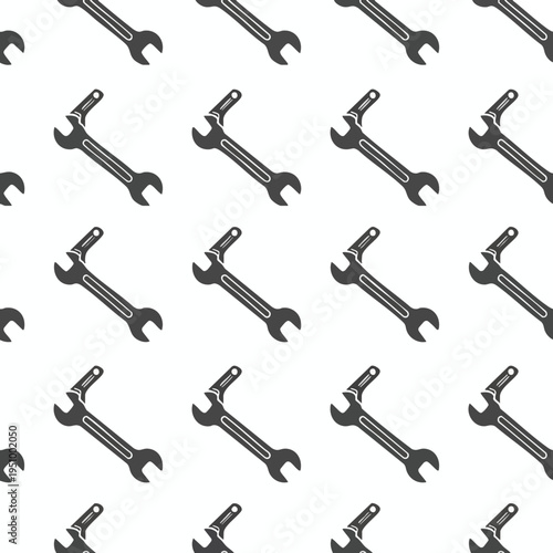 A repeating pattern of dark gray wrenches on a white background