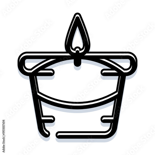 Small illuminated tealight candle burning providing warm light and a peaceful atmosphere, suitable for relaxation, meditation, and home decor concepts