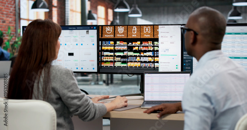 Εκτύπωση καμβά Young Store Manager Analyzes Supermarket Shelf Layout On Computer Screen