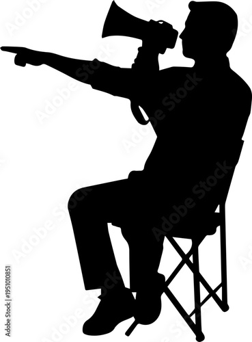 Black Silhouette of a Film Director Sitting in a Chair Using a Megaphone and Pointing