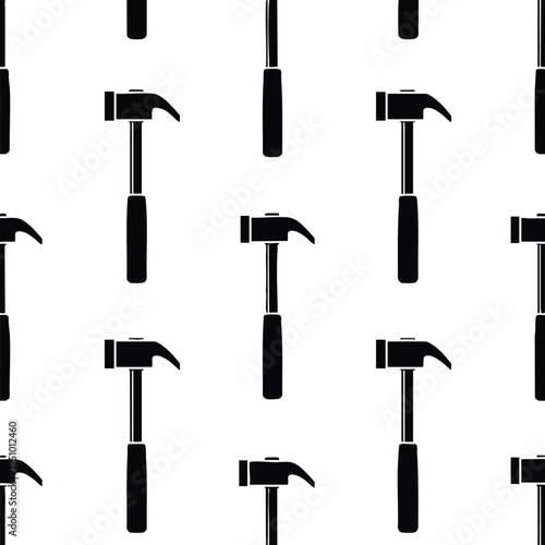 A black and white repeating pattern of hammers and chisels