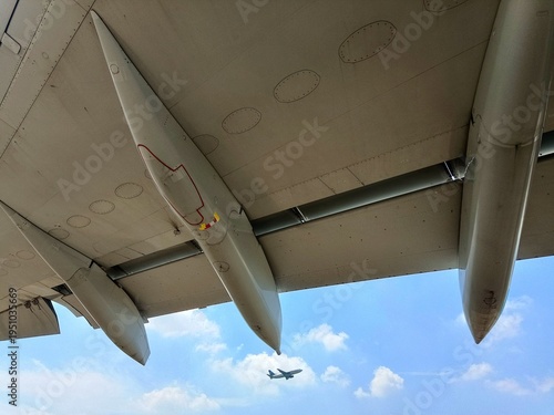 Photography Close-up photo of an aircraft wing taken from below with the canoe fairing and s