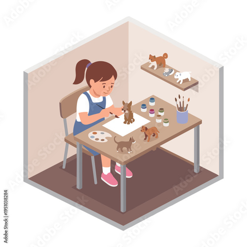 A young girl sits at a desk painting a sculpture in her studio